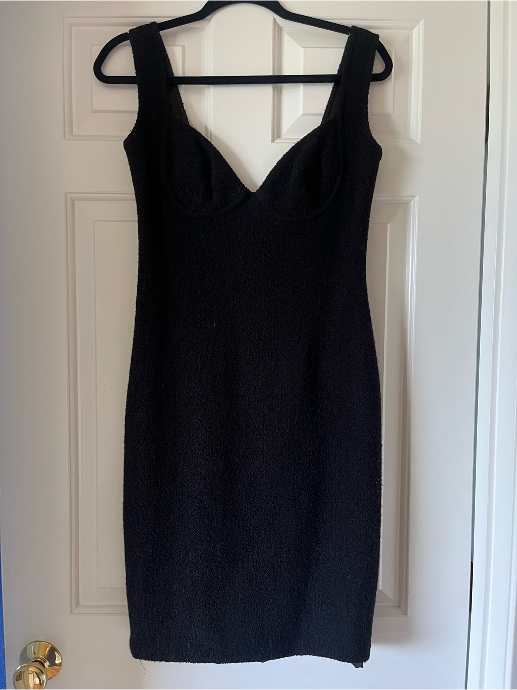 Sleek Black Mini Dress With Structured Bust